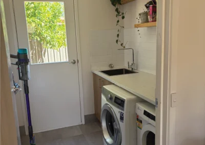 laundry with green window view